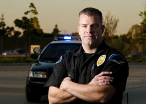 Police officer in front of car